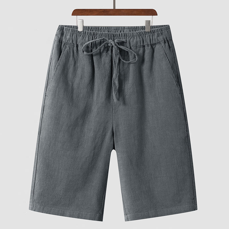 Men's casual loose cropped linen shorts in dark gray with elastic waistband and drawstring closure