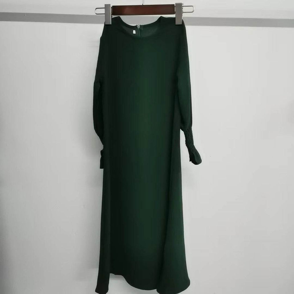 Green round neck long sleeve dress with wavy ruffled sleeves and long skirt made of polyester fiber