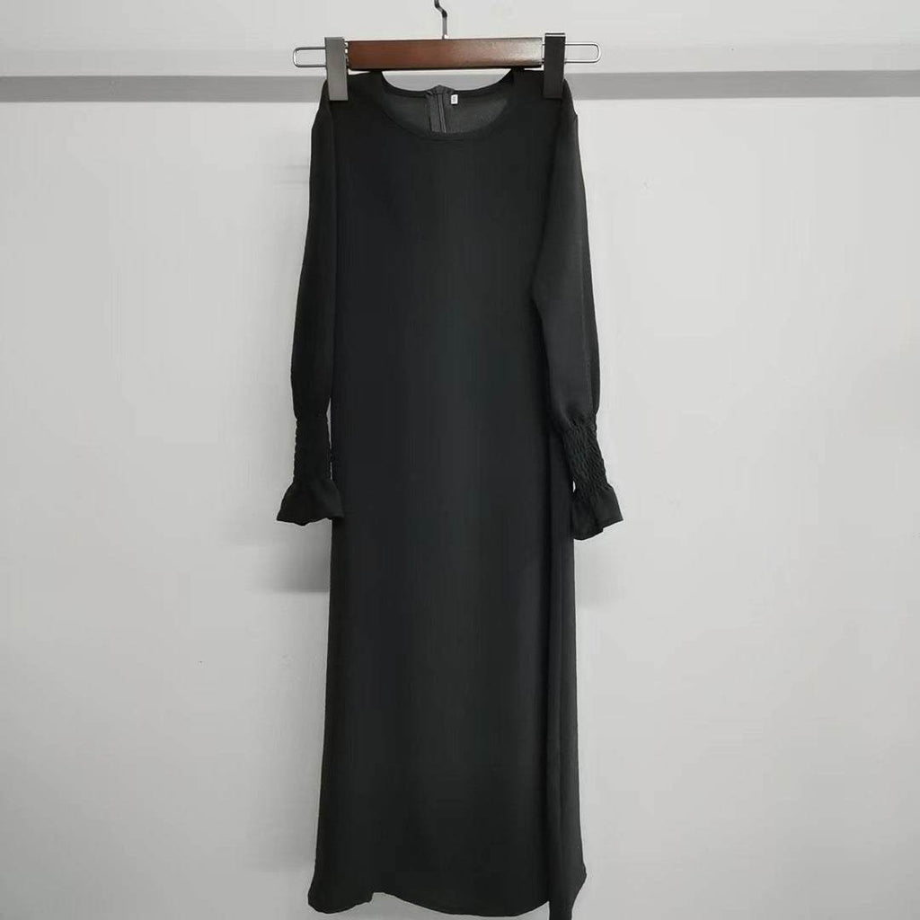 Long black round neck dress with wavy ruffled long sleeves made of polyester fiber