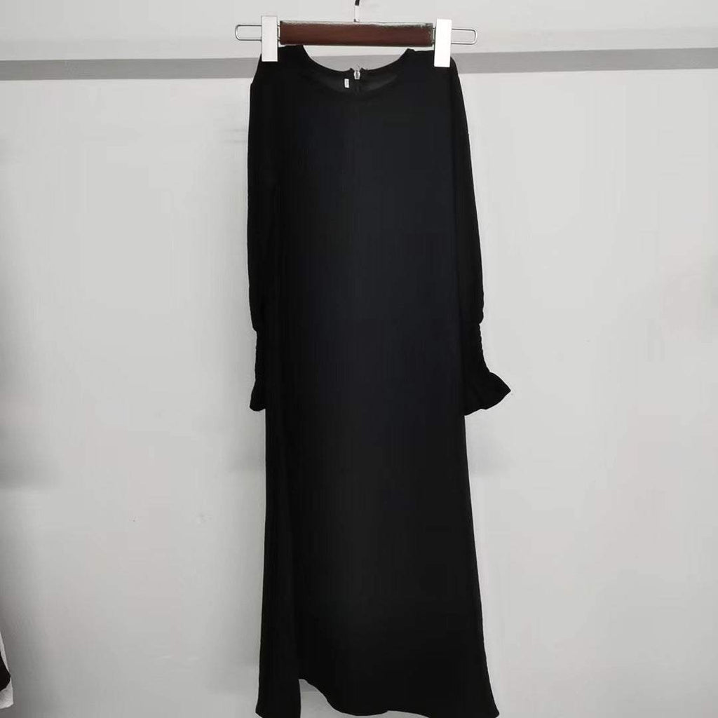 Black long sleeve round neck dress with wavy ruffled sleeves and solid color polyester fabric