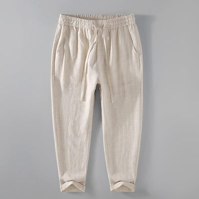 Pantalon en lin pour homme beige, coupe ample avec ceinture élastique et poches latérales, tissu breathable idéal pour l'été