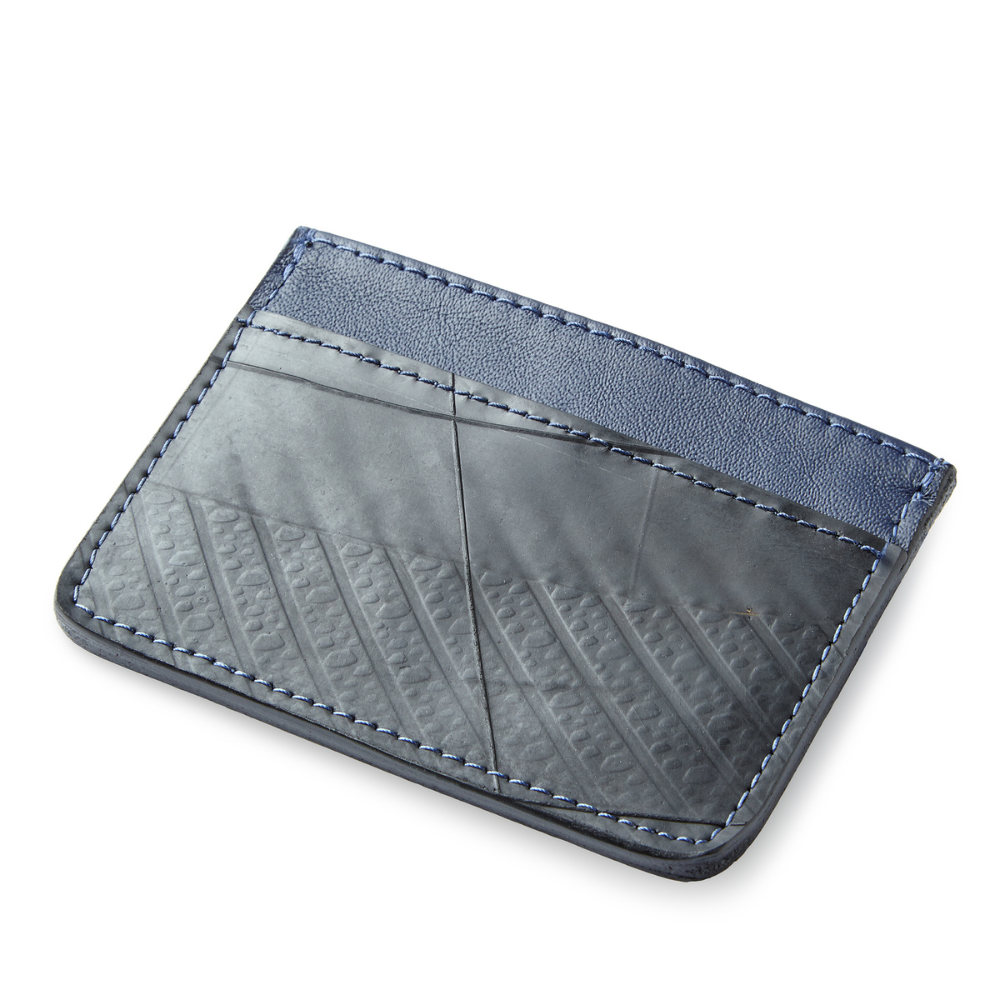 The Voyageur Card Holder made from upcycled leather reclaimed from plane seats with multiple card slots and a central cash pocket.