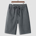 Men's casual loose cropped linen shorts in dark gray with elastic waistband and drawstring closure