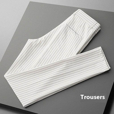 Thin casual striped white loose men's suit pants folded on gray surface