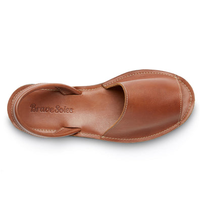 brown leather Avarca slide sandal with open toe and ankle strap, handcrafted with ethically sourced leather and upcycled tire sole for comfort and durability