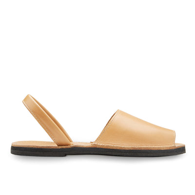 The Avarca Slide Sandal handcrafted tan leather open-toe comfortable flat sandal with ankle strap and upcycled tire sole