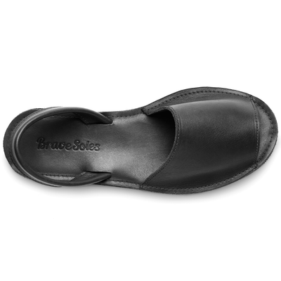 The Avarca Slide Sandal black leather handcrafted comfort slide with ankle strap and cushy sole
