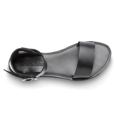 The Camila Leather black flatform sandal with cushy midsole and ankle strap, handcrafted from ethical leather and upcycled tire sole