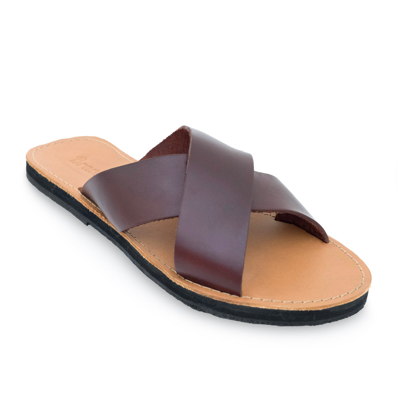 Genuine leather slides with crisscross straps, cushy EVA foam mid-sole, and upcycled tire sole for sustainable comfort