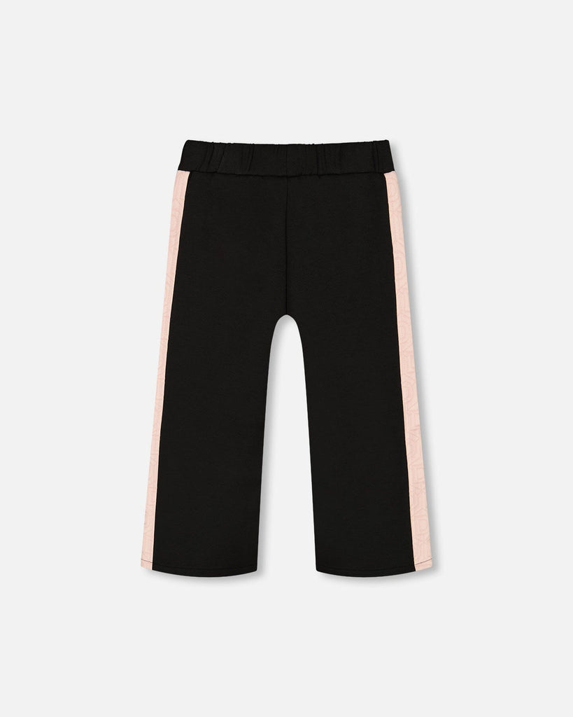 Black cropped wide leg pant with pink contrast side bands and elastic waistband
