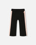 Black cropped wide leg pant with pink contrast side bands and elastic waistband