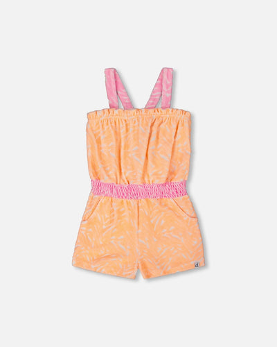 Printed terry cloth romper in vibrant orange and white with pink straps and elastic waistband