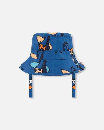 Printed beach hat with orange sloths on navy blue, UPF 50+ sun protection, bucket style with chin straps