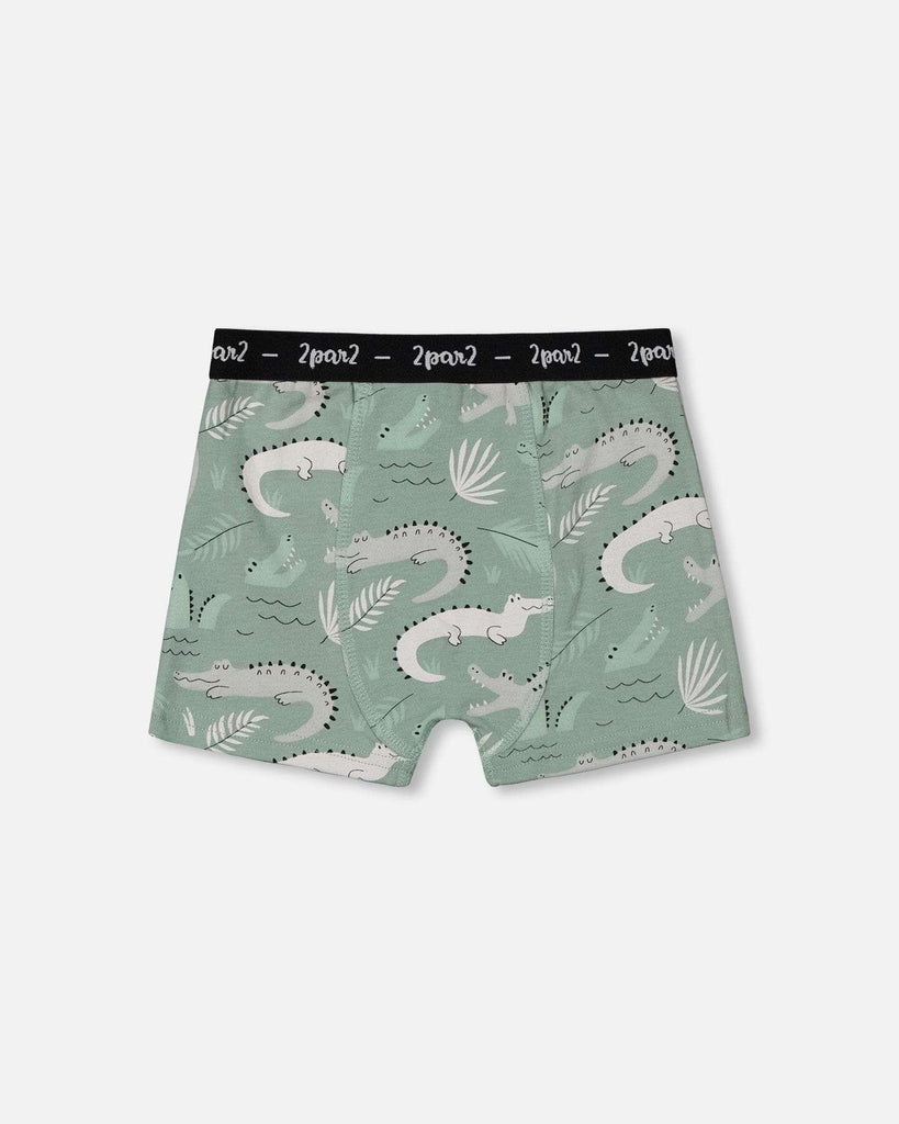 Printed organic cotton boxer shorts in light sage with gray crocodile print and black elastic waistband