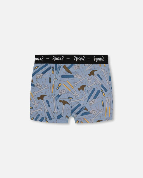 Printed organic cotton boxer shorts with colorful tool print and black logo elastic waistband on bluish gray background