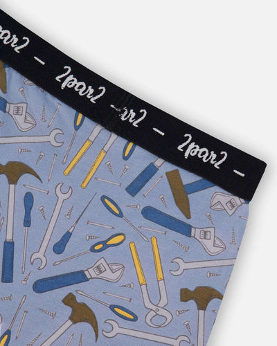 Printed organic cotton boxer shorts with colorful tool print on bluish gray background and black elastic waistband
