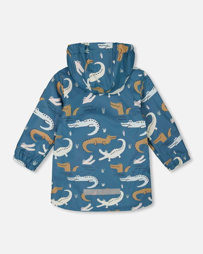Blue raincoat with color-changing crocodile print, attached hood, and reflective accents for kids