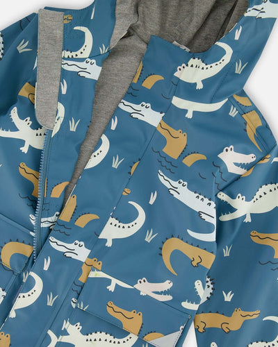 Blue raincoat with color-changing crocodile print and attached hood