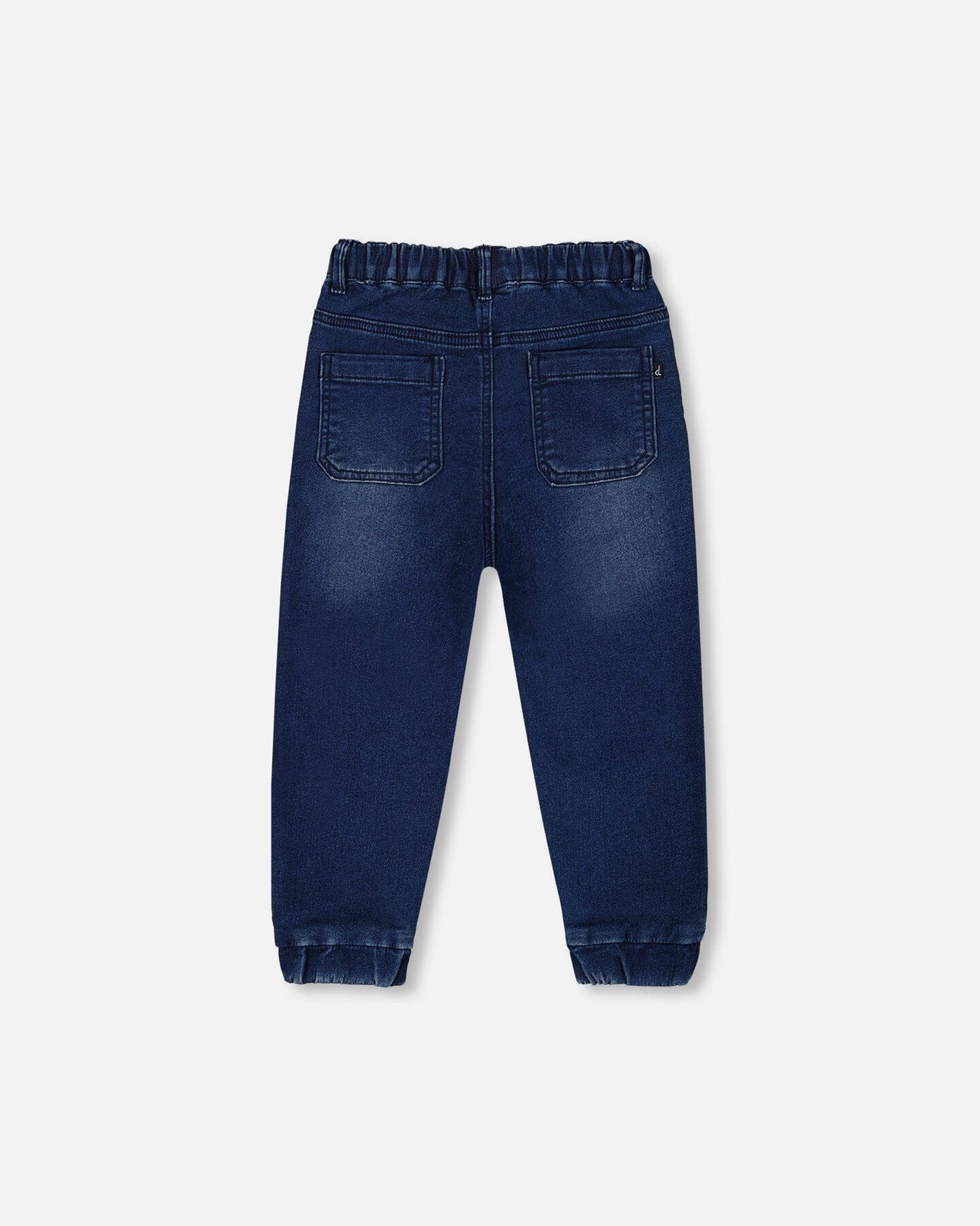 Back view of dark denim blue French Terry Denim Jogger Pant with elastic waistband and ankle cuffs