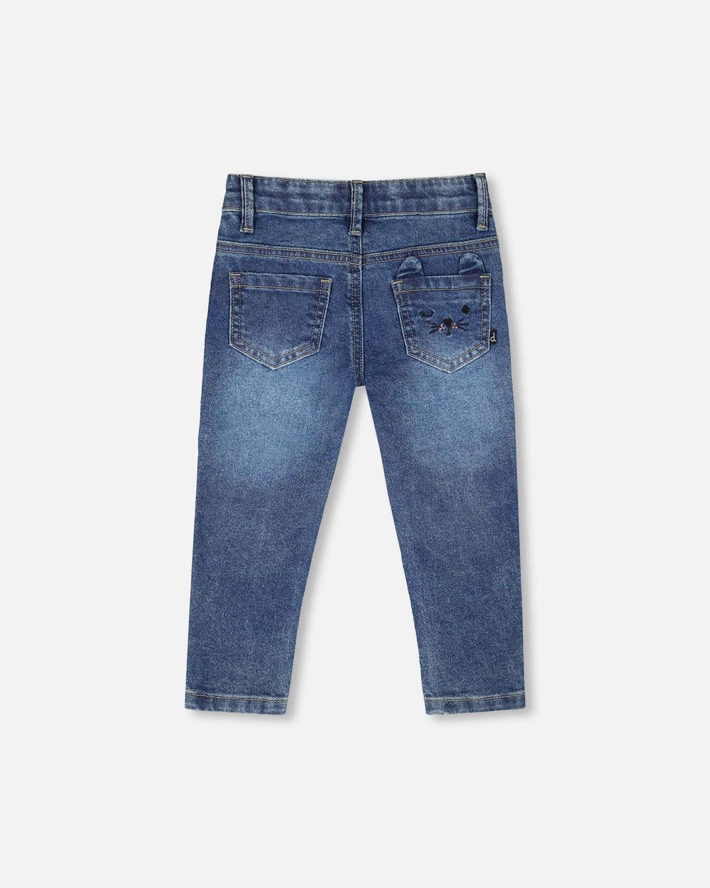 Back view of children's jeans blue denim with embroidered cat face on pocket and practical front and back pockets