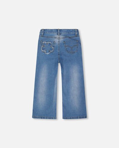 Wide leg stretch light blue denim jeans with flower stitching and back pockets