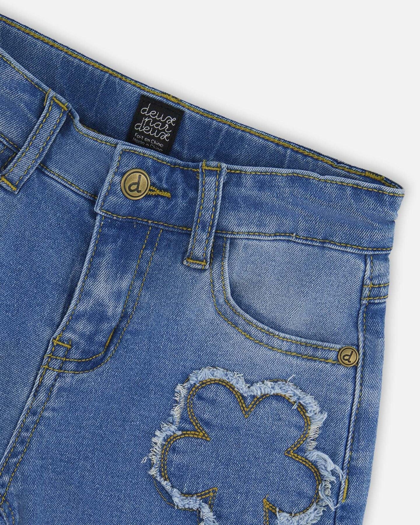 Wide leg stretch light blue denim jeans with flower stitching and front pockets