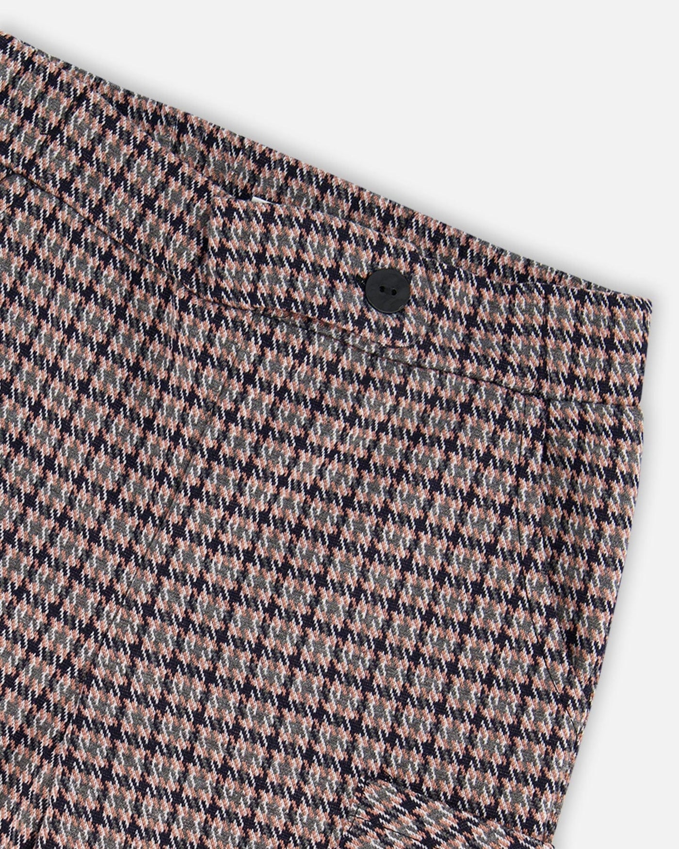Close-up of Jacquard Knit Flare Pants featuring a houndstooth pattern and a black button on the waistband