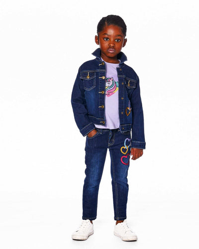 Child wearing stretch jeans blue denim with colorful glittery heart appliques and a dark denim jacket