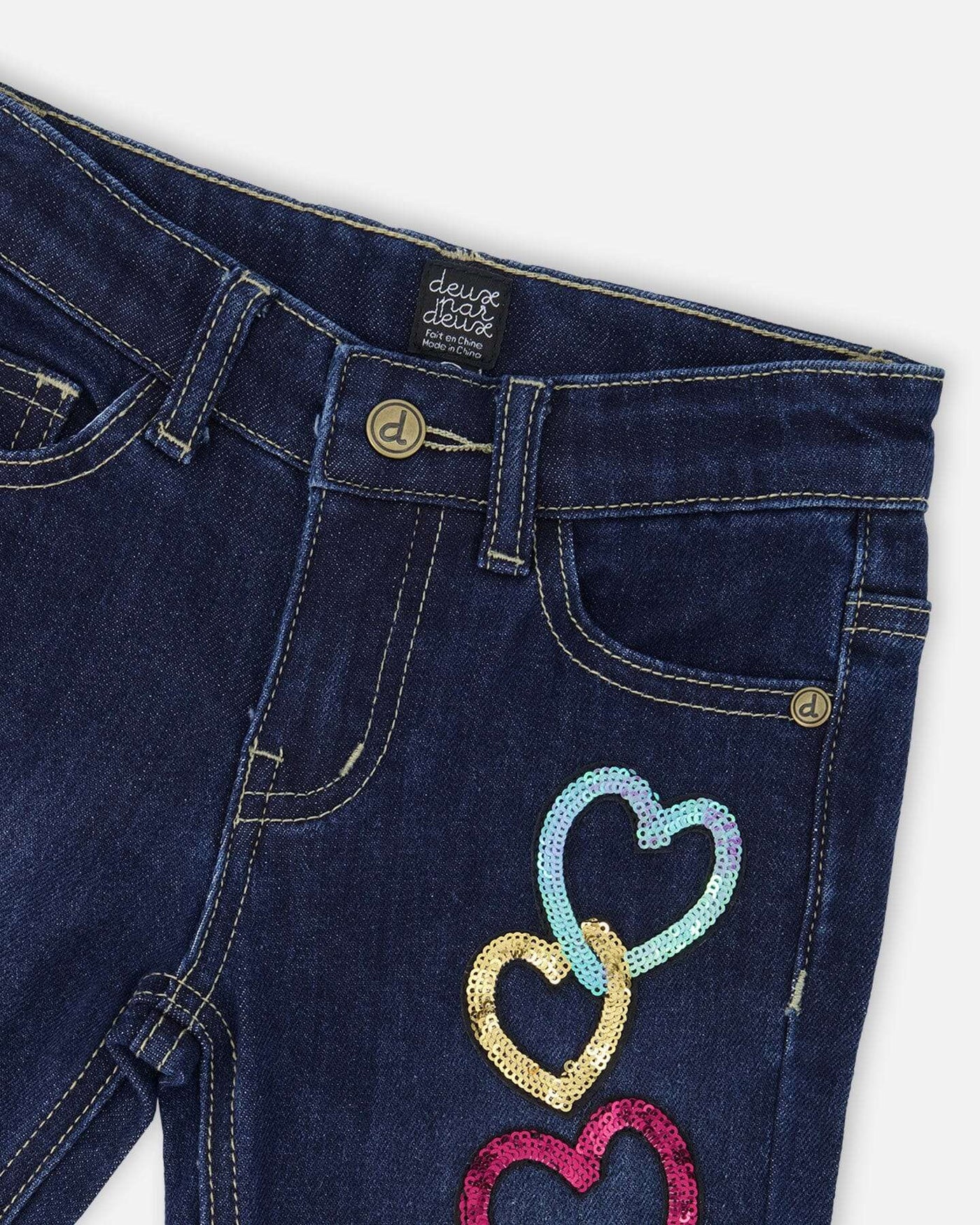 Blue stretch jeans with glittery heart appliques and contrast stitching
