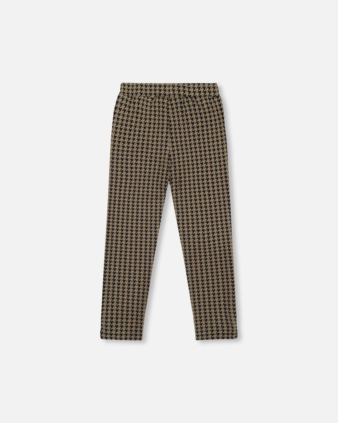 Jacquard knit pant with houndstooth pattern, slim straight fit, and button welt pockets.