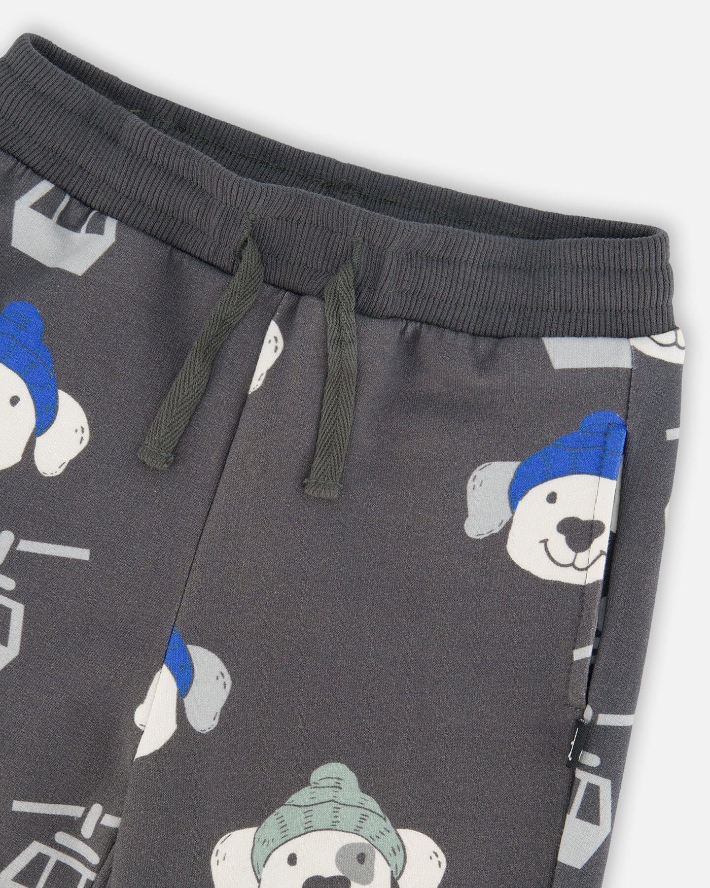 Gray fleece sweatpants with playful puppy and ski gondola print, drawstring waistband, side pockets, and rib knit cuffs.
