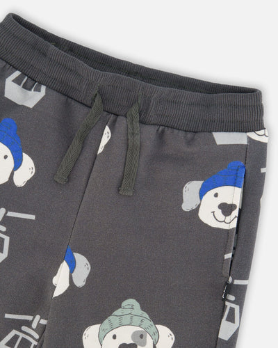 Gray fleece sweatpants with playful puppy and ski gondola print, drawstring waistband, side pockets, and rib knit cuffs.