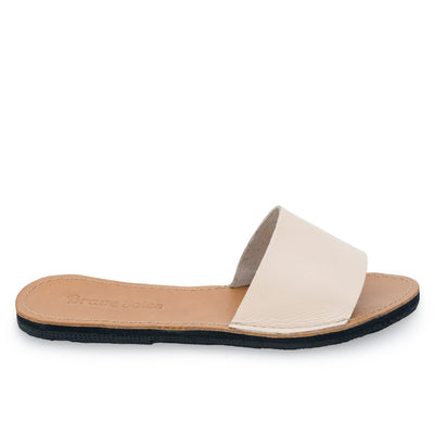The Linda Leather Slide sandal with ethically sourced leather, cushy foam mid-sole, hand-cut soles from upcycled tires, and secure ankle strap.