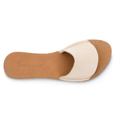 The Linda Leather Slide sandal with ethically sourced leather, cushy EVA foam mid-sole, and hand-cut sole from upcycled tires