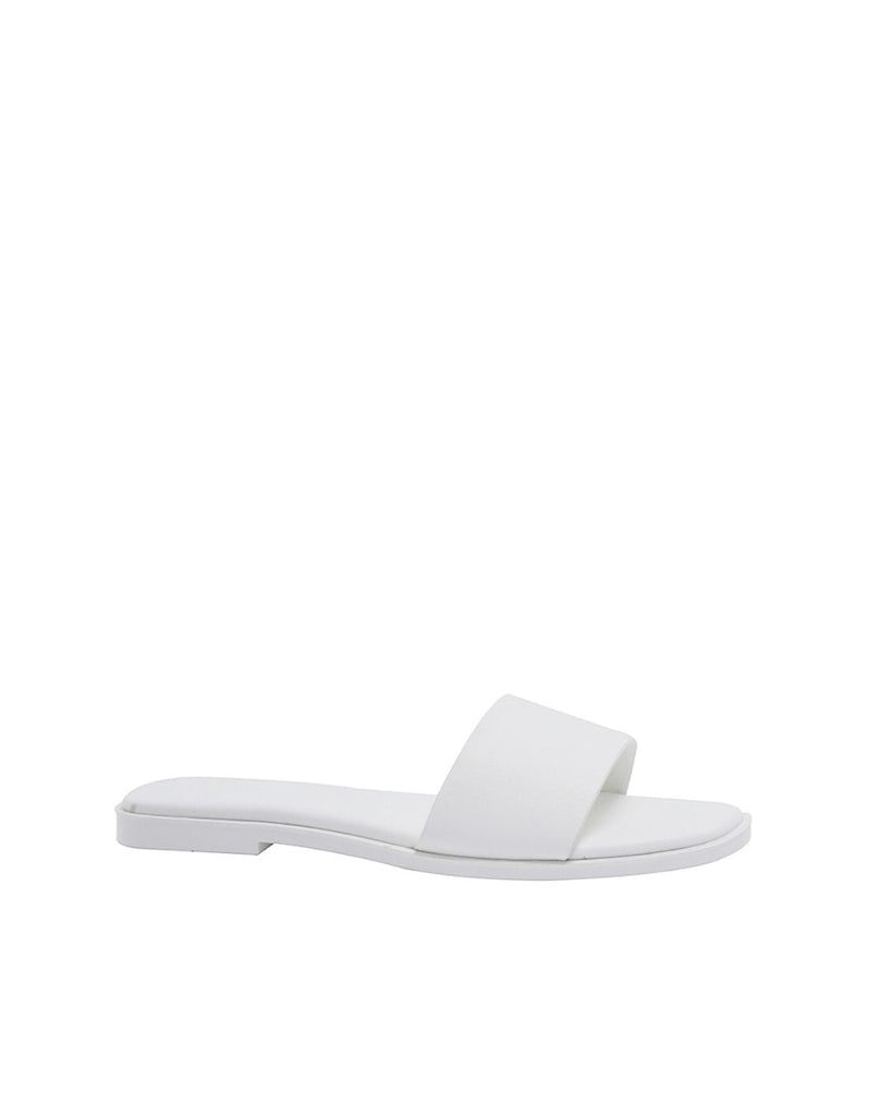 White Lucille Flat Sandal with wide single strap and memory foam padded insole