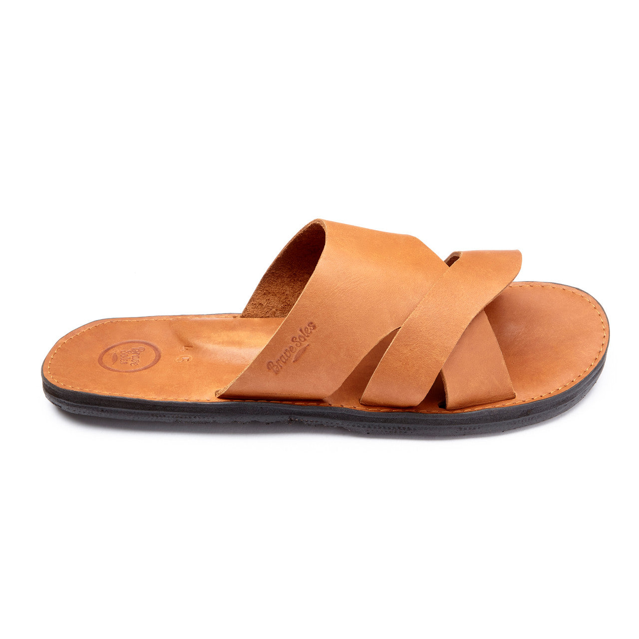 The Mateo Men's Leather Slide sandal with handcrafted leather straps and upcycled tire sole, featuring arch support and cushy foam mid-sole