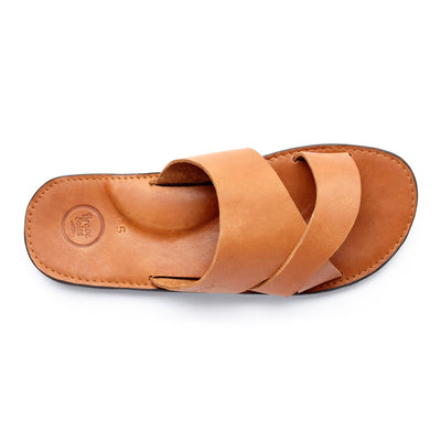 The Mateo Men's Leather Slide sandal in tan with cushioned arch support and handcrafted leather footbed