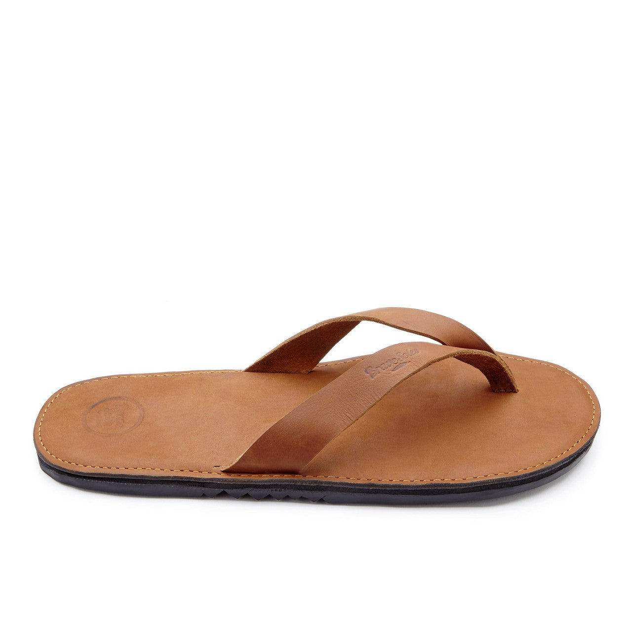 The Novio men's leather flip flop with brown leather strap and cushioned sole, handmade in the Dominican Republic