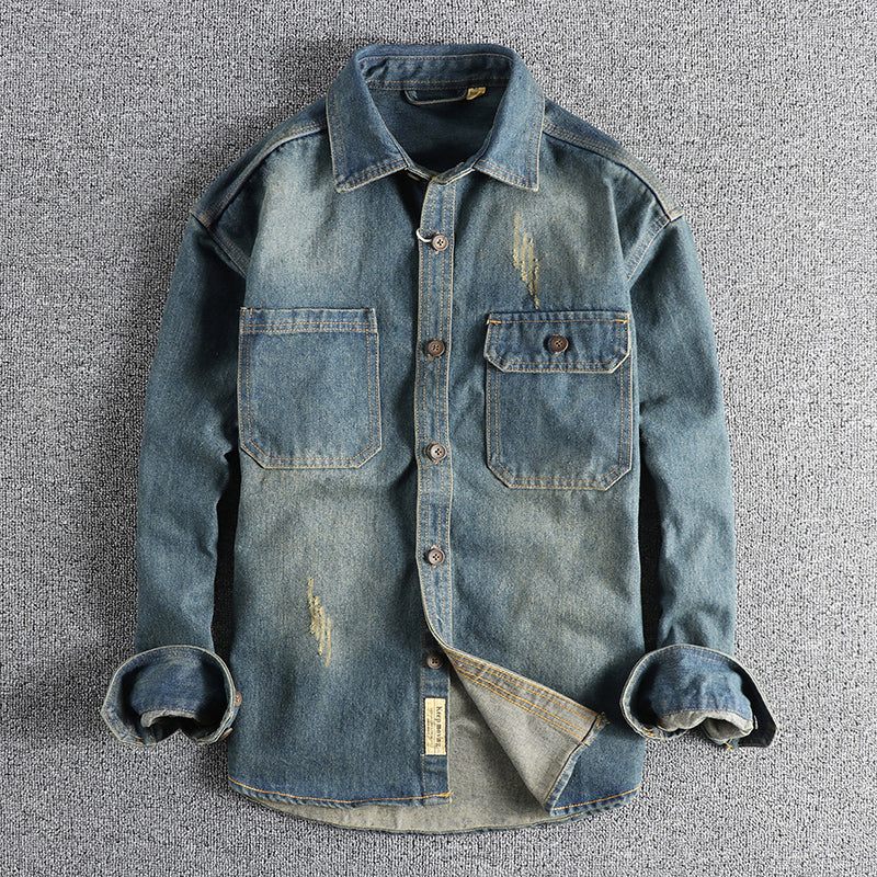 Washed vintage denim shirt for men with long sleeves and front pockets in faded blue cotton