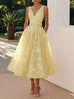 Elegant yellow women's sleeveless vest dress with V-neck and high waist floral pattern
