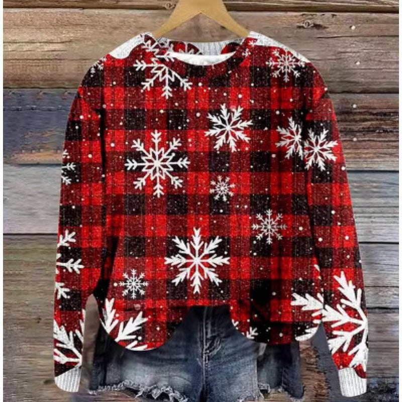 Red and black checkered round neck sweater with white snowflake digital print, polyester fabric, hanging on wooden hanger