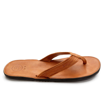 The Padre men's leather flip flop with handmade leather footbed and upcycled tire sole in tan brown color