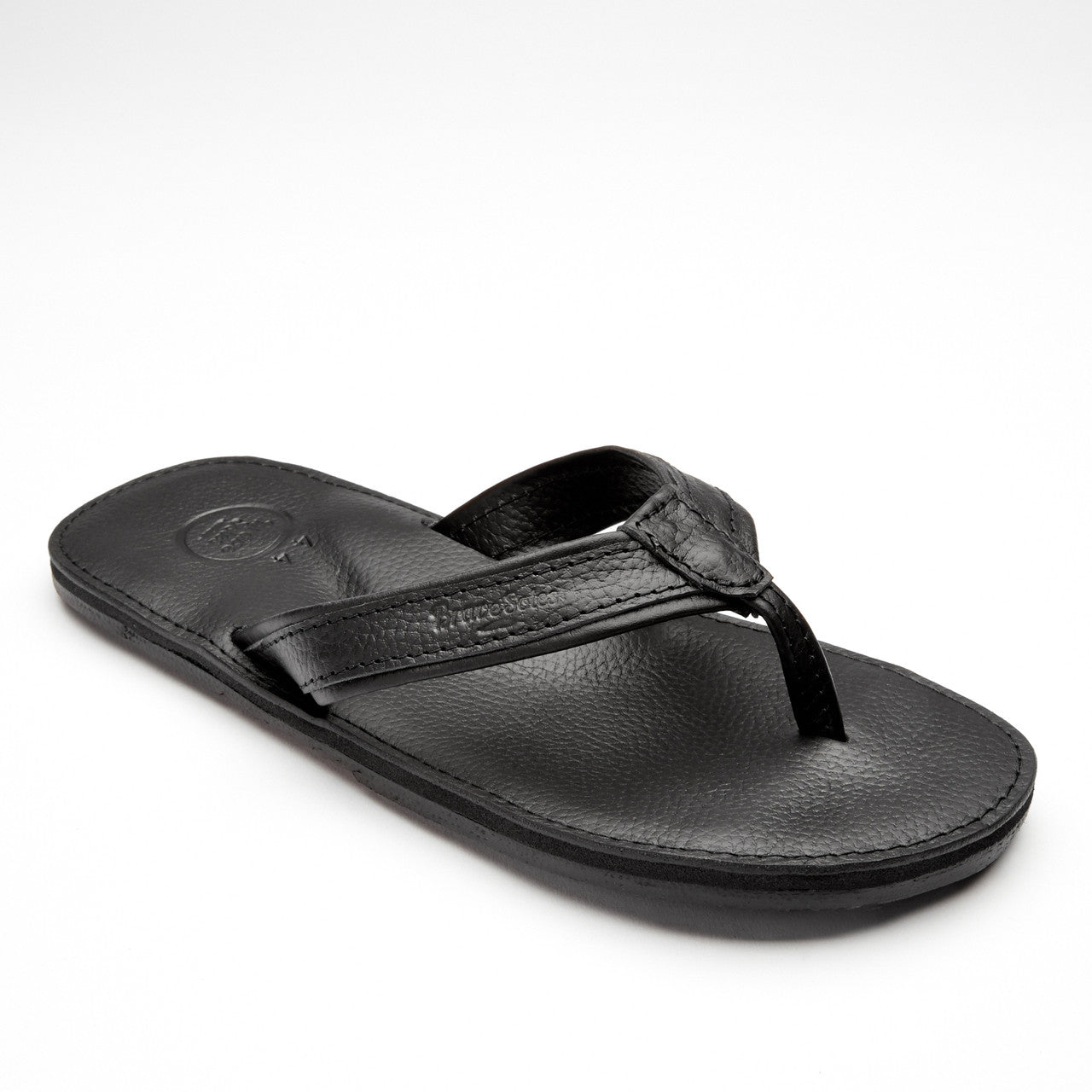 The Padre Men's Leather Flip Flop black handcrafted leather sandal with cushioned sole and upcycled tire tread outsole