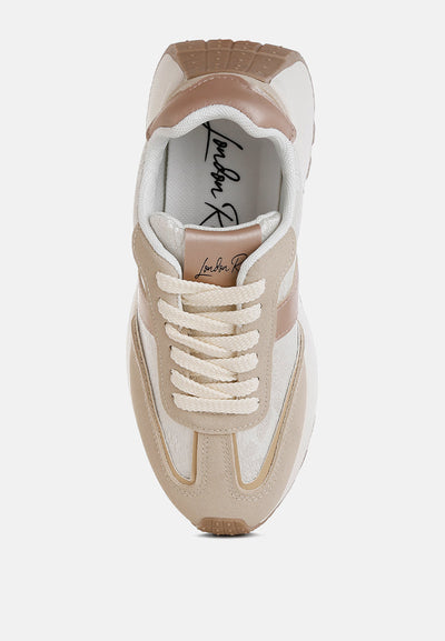 Squeaker Chunky Anti-Skid lace-up sneakers in beige microfiber and fabric with cushioned sole and chunky flatform heel.