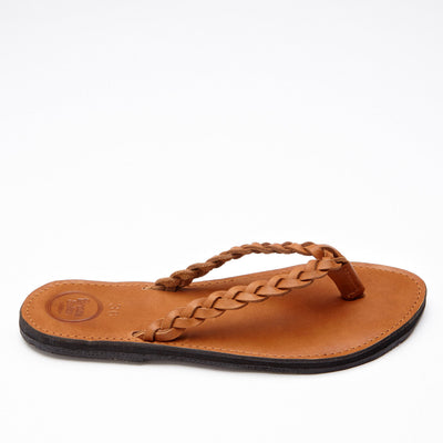 Handcrafted brown braided leather flip flop with cushioned sole and upcycled tire bottom