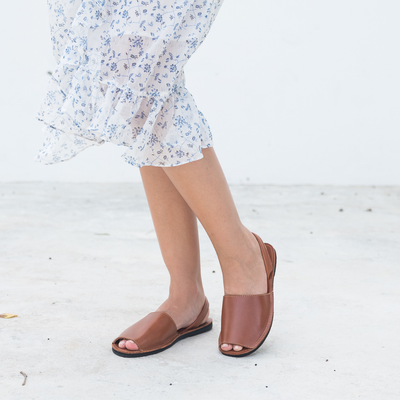 The Avarca Slide Sandal brown leather open-toe handcrafted with upcycled tire sole and comfortable ankle strap