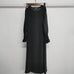 Long black round neck dress with wavy ruffled long sleeves made of polyester fiber