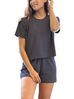 Woman wearing Creamfields Organic Cotton short and matching top set in navy blue, made of soft breathable fabric