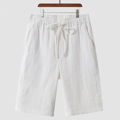 Men's casual loose fit white linen shorts with drawstring waist and pockets
