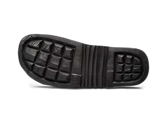 Sole of Antonio Men's Leather Slide sandal made from recycled tire inner tube material with textured tread pattern